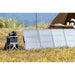 EcoFlow RIVER 2 portable power station charging via solar panel at campsite