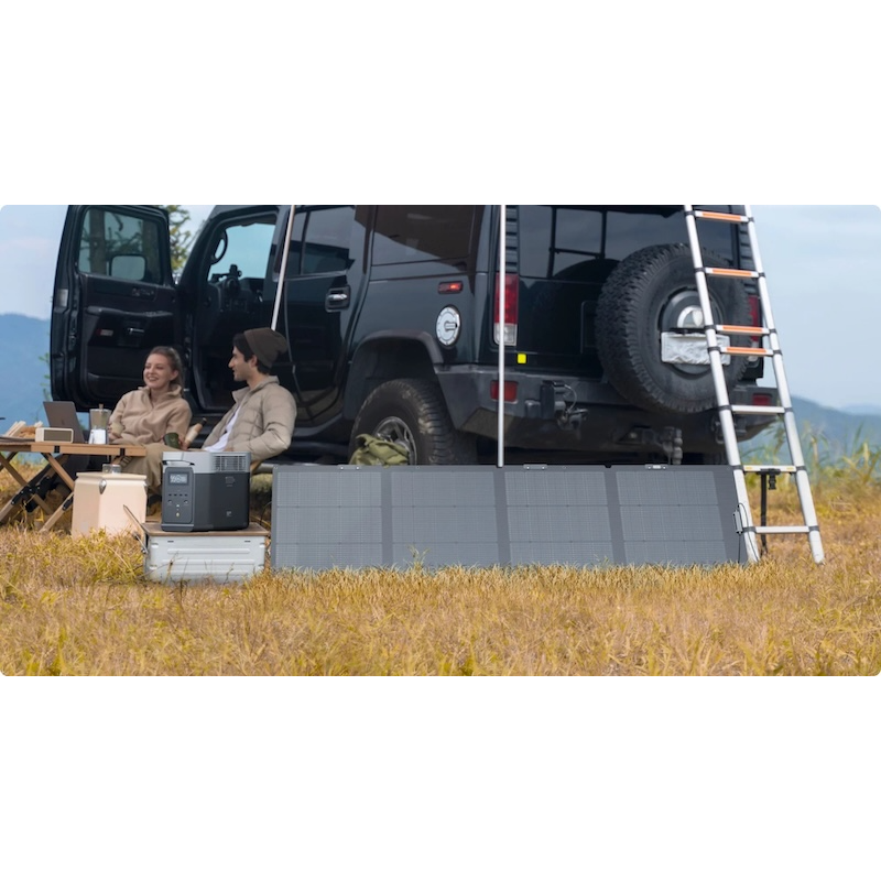 EcoFlow portable solar panel powering EcoFlow power station at campsite with vehicle setup