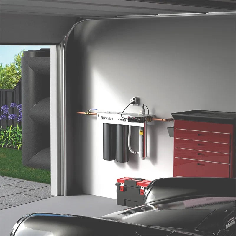 Puretec Hybrid R2 whole house rainwater filtration system installed on wall connected to tank water supply