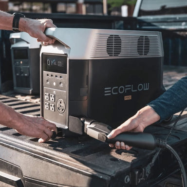 EcoFlow Delta Pro portable power station being connected in the back of a pickup truck for mobile power use