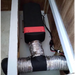 Heatport H4S 4kW diesel heater installed inside caravan locker with split ducting setup feeding two warm air vents.
