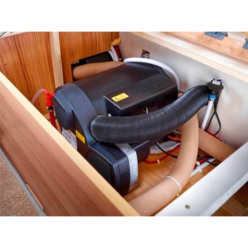 t: Heatport H2S diesel heater installed inside caravan storage compartment with ducting and fuel line setup